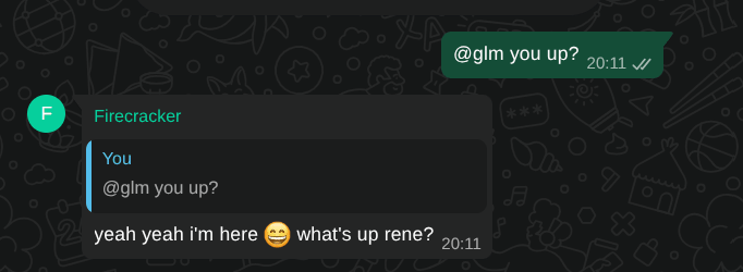 GLM answering "@glm you up?" in the WhatsApp group with "yeah yeah i'm here 😄 what's up rene?"